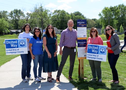 Staff from United way, human kinetics and the Champaign Park District celebrate a ribbon cutting